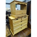 A pine unit with wicker drawers, two over three,