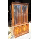 A glazed bookcase CONDITION: Please Note - we do not make reference to the