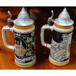 A pair of German ceramic Stein mugs, with Munich decoration.
