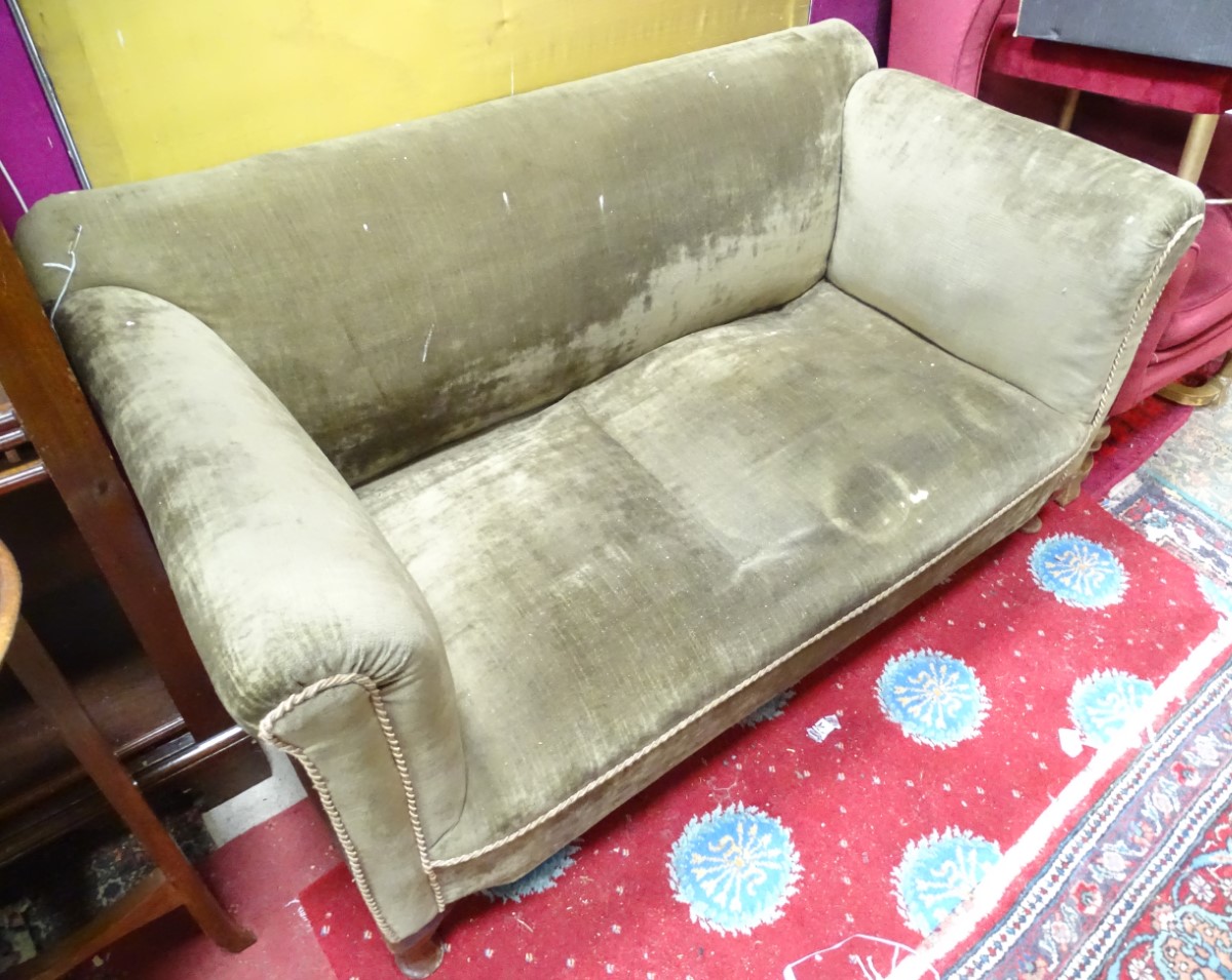 A 2 seater Edwardian Chesterfield style turned leg sofa CONDITION: Please Note -