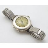 A silver cased wristwatch by J W Benson, London.