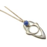 A silver pendant and chain, the Art Nouveau style pendant set with lapiz lazuli bead drop .