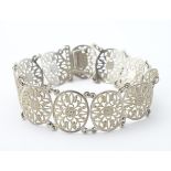 A Continental .835 silver bracelet set with 11 oval vignettes.