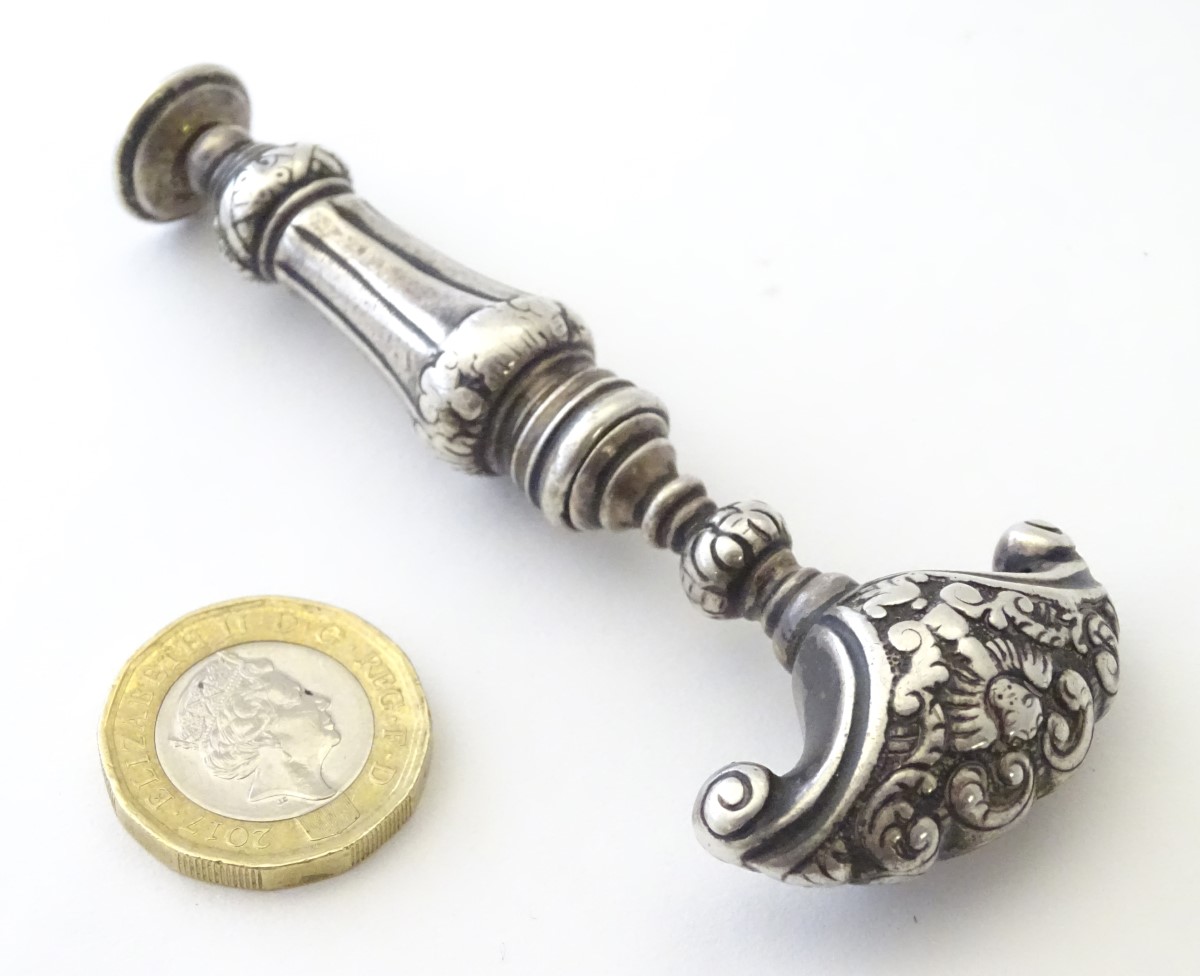 Corkscew : A 18thC Dutch white metal ( silver) corkscrew with shaped handle having acanthus - Image 7 of 10