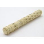 A 19thC bone needle / bodkin case with roundel decoration. Approx. 3 3/4" long.