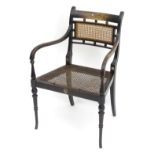 A late 19thC George Henry Walton designed Arts & Crafts open armchair, with caned seat and backrest,