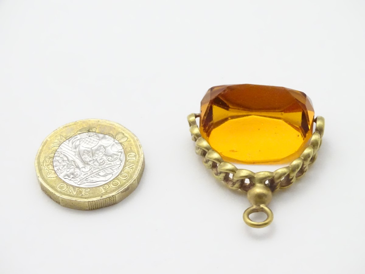 A pendant fob with central rotating citrine paste stone 1 ½” long CONDITION: Please - Image 7 of 9