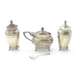 A 3-piece silver cruet set comprising mustard pot, and two pepperettes,