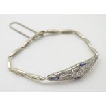 An 18ct white gold bracelet set with diamonds and sapphire spinels in an Art Deco setting