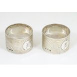 A pair of Art Deco silver napkin rings with engine turned decoration Sheffield 1933 maker Viners