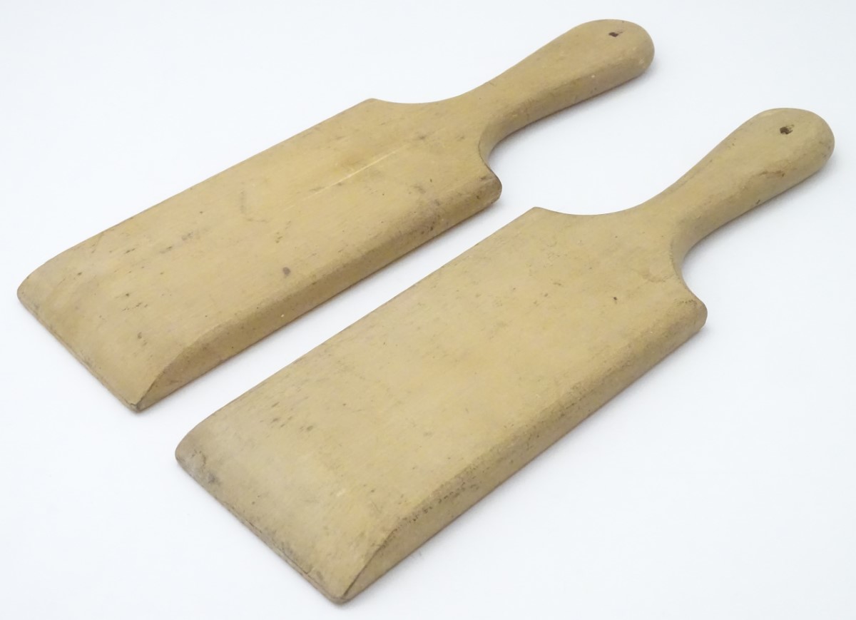 A pair of late 19th / early 20thC carved beech butter pats, each 11" long. - Image 7 of 8