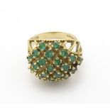 A 9ct gold dress ring set with emerald cluster CONDITION: Please Note - we do not