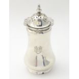 A silver sugar caster / dredger with fret work decoration to top rim.