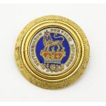 A 19thC brooch set with oval rotating Geo IV 1826 coin with enamelled decoration to one side.