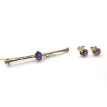 A 9ct gold bar brooch set with oval amethyst 2 1/4" wide together with 9ct gold stud earrings set