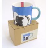 A blue Joules mug with a cow decoration CONDITION: Please Note - we do not make