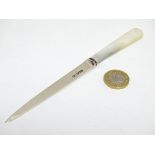 A silver paper knife / letter opener with mother of pearl handle. Hallmarked Sheffield 1934.