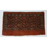 Carpet / Rug: An old hand made Bokara rug.
