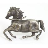 Equine Interest : A white metal brooch formed as a galloping horse.