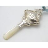 A baby's silver rattle with mother of pearl teether,