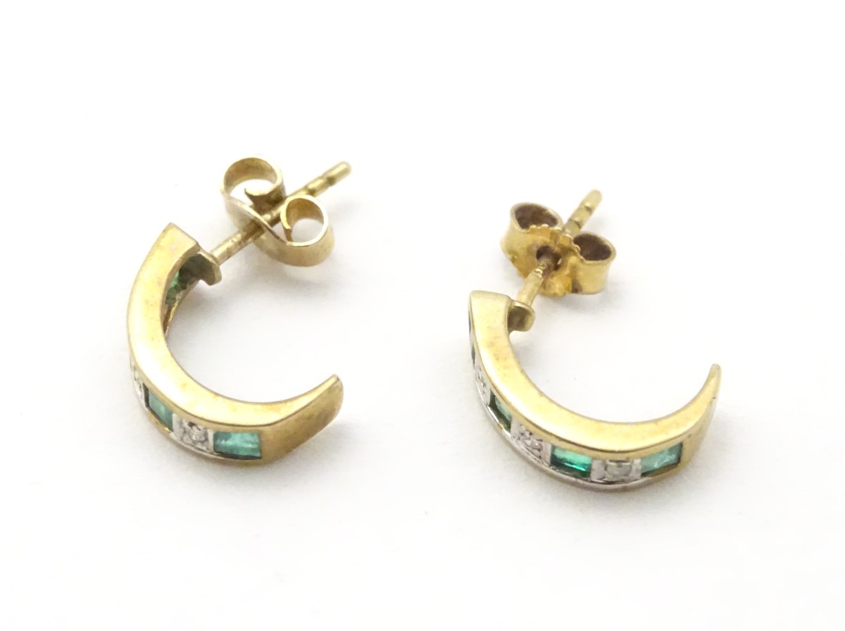 A pair of 9ct gold earrings set with diamonds and emeralds. - Image 4 of 11