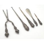 Assorted silver handed items including button hooks,