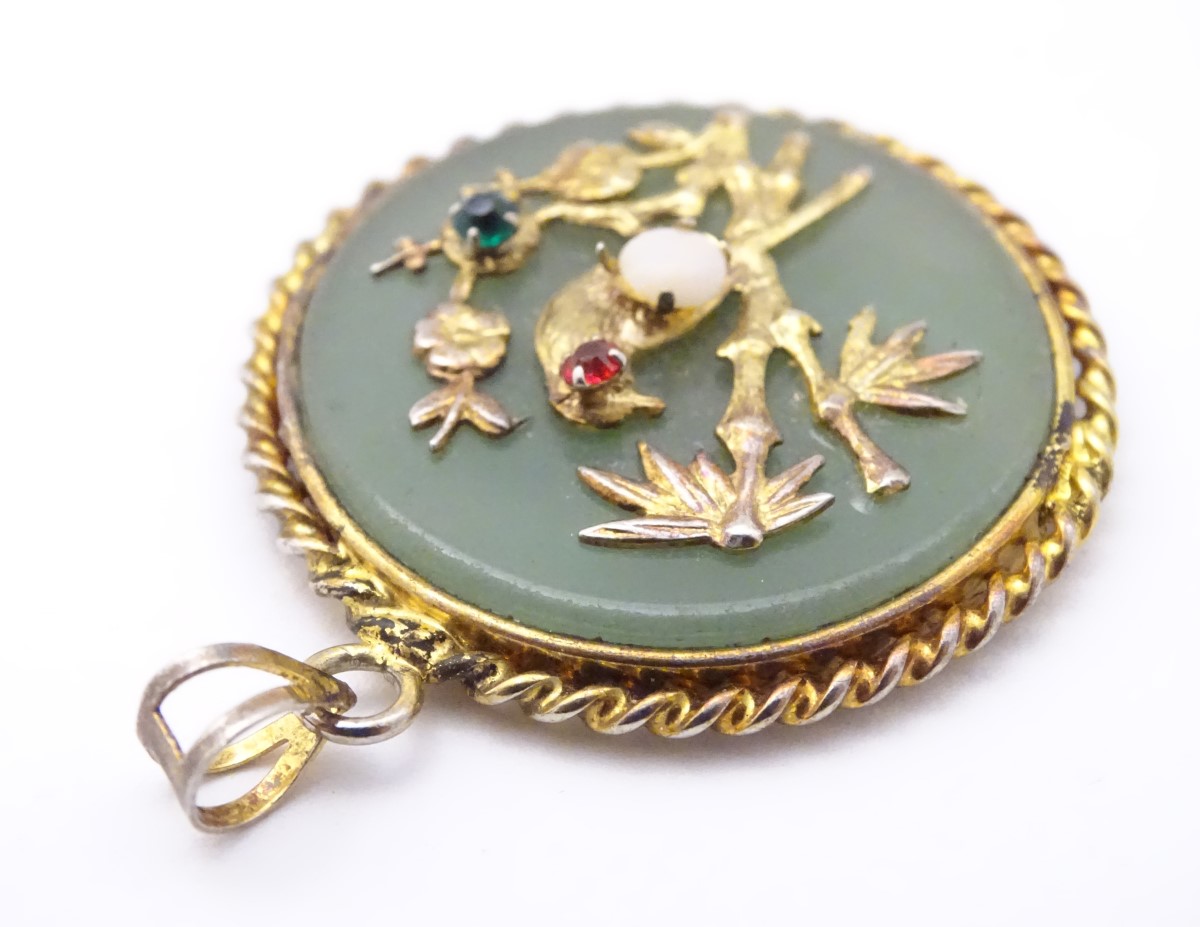 An Oriental pendant of circular form set with jadite stone to centre with bird and foliate - Image 3 of 10