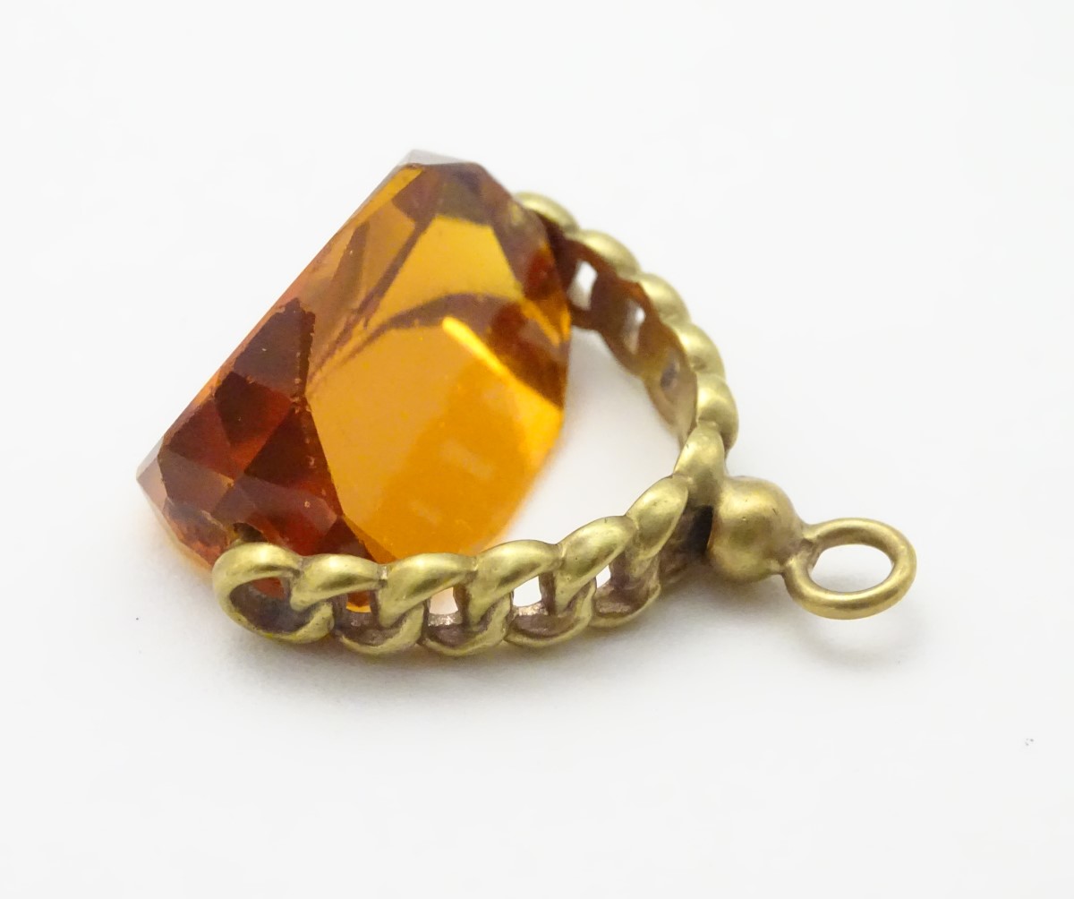 A pendant fob with central rotating citrine paste stone 1 ½” long CONDITION: Please - Image 2 of 9