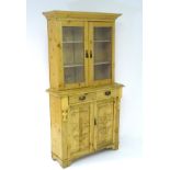 A late 19thC glazed pine dresser,