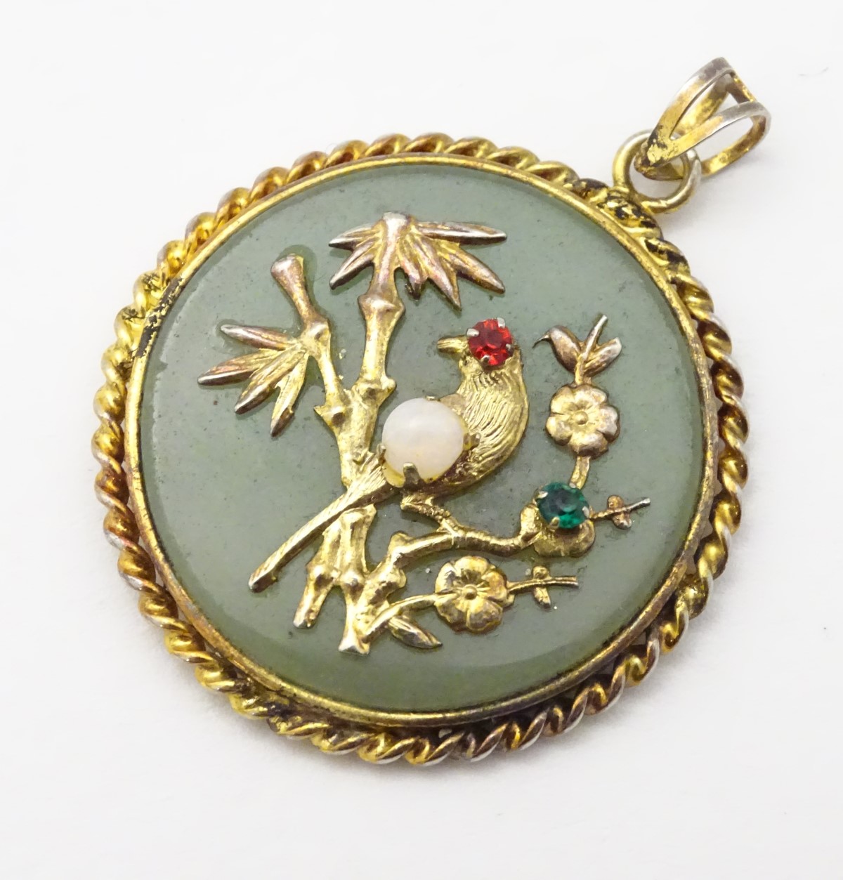 An Oriental pendant of circular form set with jadite stone to centre with bird and foliate - Image 8 of 10