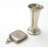 A small shaped silver vesta case with engraved acanthus scroll decoration.