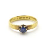 A 22ct gold ring set with blue stone CONDITION: Please Note - we do not make