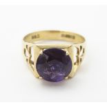 A 9ct gold ring set with central round cut Amethyst CONDITION: Please Note - we do