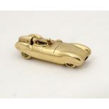 A gold vintage pendant / charm formed as an early racing car 1 1/8" long CONDITION: