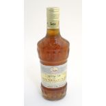 A single bottle of Cave des Vignerons, Beaumes de Venise muscat desert wine,