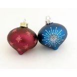 Christmas decorations : two glass baubles one Burgundy the other teal.