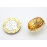 A gold pendant set with facet cut citrine 1" long CONDITION: Please Note - we do