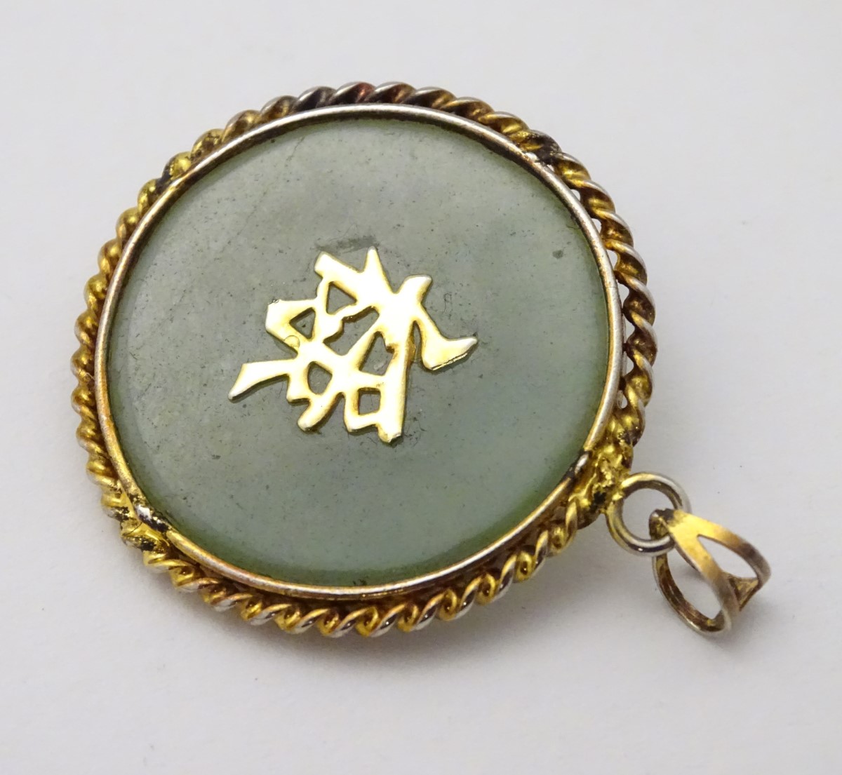 An Oriental pendant of circular form set with jadite stone to centre with bird and foliate - Image 9 of 10