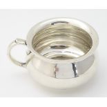 A silver punch cup hallmarked London 1938 maker Goldsmiths & Silvermsiths Co.