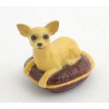 A Beswick model of a Chihuahua dog seated on a cushion, model no. 2454. Marked under. Approx.