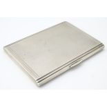 An Art Deco silver cigarette case with engine turned decoration hallmarked Birmingham 1937 maker D