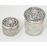 2 cut glass dressing table jars with silver tops one hallmarked Birmingham 1900 maker The Alexander
