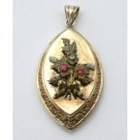 A late 19thC / early 20thC gold pedant formed locket set with floral sprig to front.