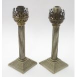 Two silver plate lamp bases / candlesticks of column form. Approx. 10" high.