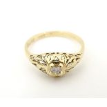 A gold ring set with central diamond CONDITION: Please Note - we do not make