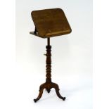 A late 19thC mahogany reading stand / music stand with an adjustable slope and brass fittings,