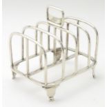 A silver 5 bar toast rack hallmarked London 1905 maker C S Harris & Sons Ltd. 5" x 4 1/" x 3 3/4".