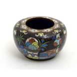 A Chinese cloisonne brush pot decorated with vases, scrolls, umbrellas, pots, books etc.