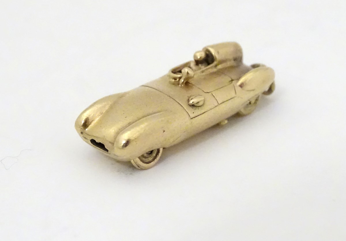 A gold vintage pendant / charm formed as an early racing car 1 1/8" long CONDITION: - Image 7 of 9