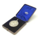 A cased silver medallion depicting horse, horseshoe and leeks, titled ' Welsh Pony and Cob Society.